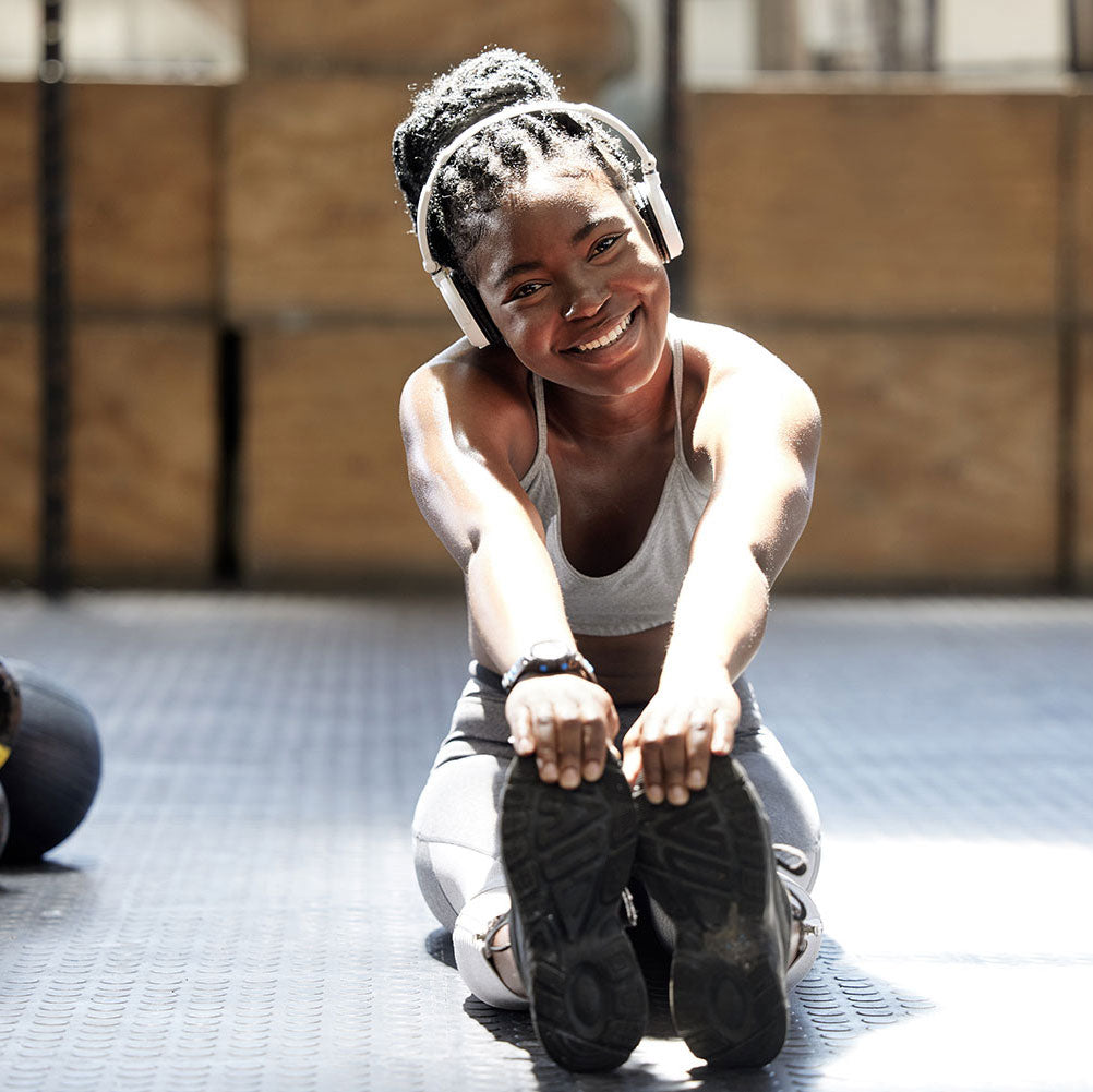 woman stretching in gym